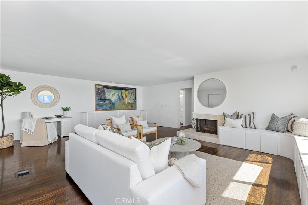 224 18th Street Manhattan Beach, CA 90266 - Photo 13 of 63 a living room with furniture a rug and a window