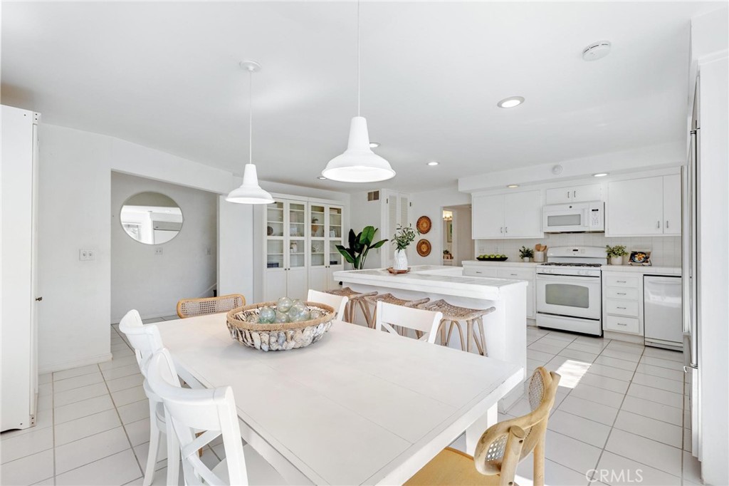 224 18th Street Manhattan Beach, CA 90266 - Photo 23 of 63 a kitchen with a white cabinets and white appliances