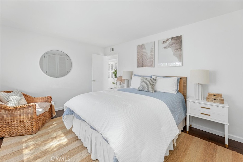 224 18th Street Manhattan Beach, CA 90266 - Photo 30 of 63 a bedroom with a bed and window