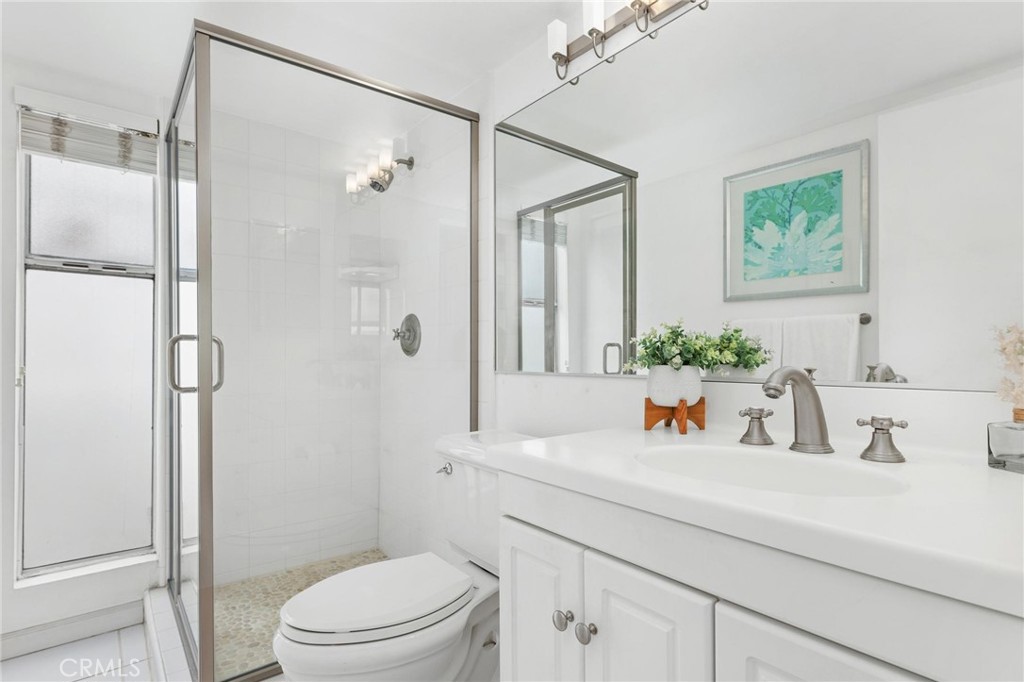 224 18th Street Manhattan Beach, CA 90266 - Photo 32 of 63 a bathroom with a sink a toilet and shower