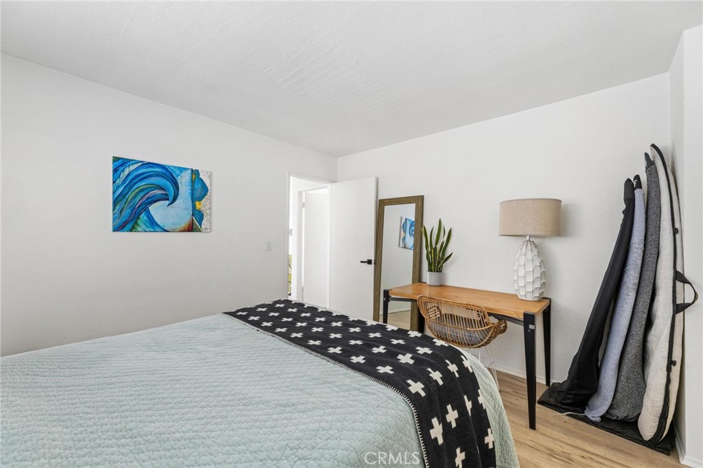 224 18th Street Manhattan Beach, CA 90266 - Photo 48 of 63 a bedroom with a bed and a painting on the wall