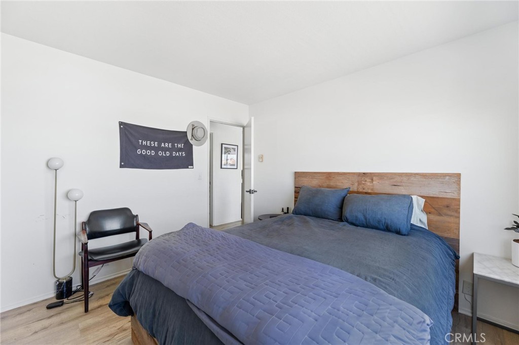 224 18th Street Manhattan Beach, CA 90266 - Photo 50 of 63 a bedroom with a bed and a chair