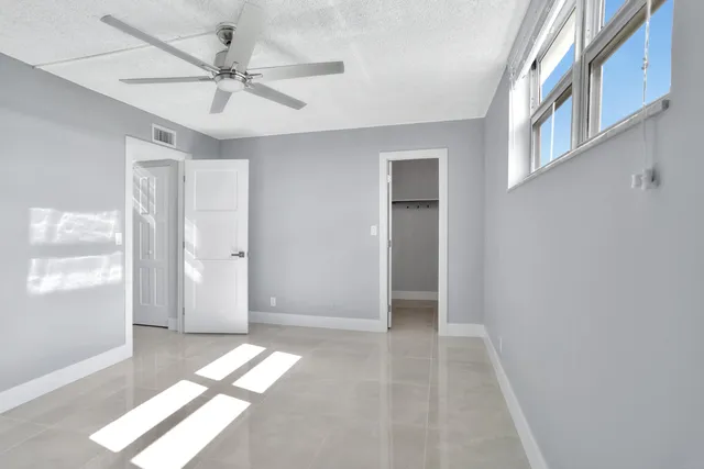 a view of an empty room with a window