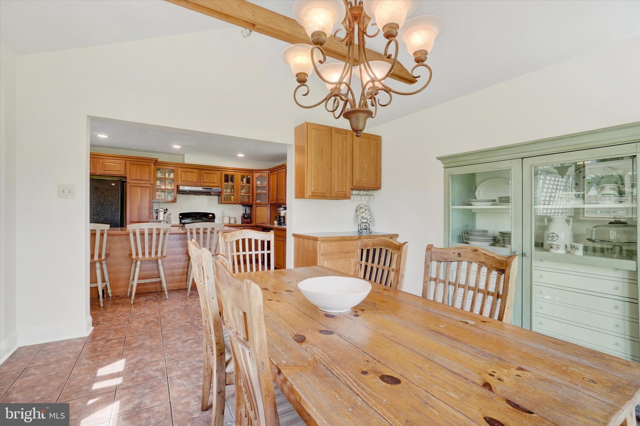 1190 Cherimoya Street York, PA 17404 - Photo 18 of 33 a view of a dining room with furniture wooden floor and chandelier