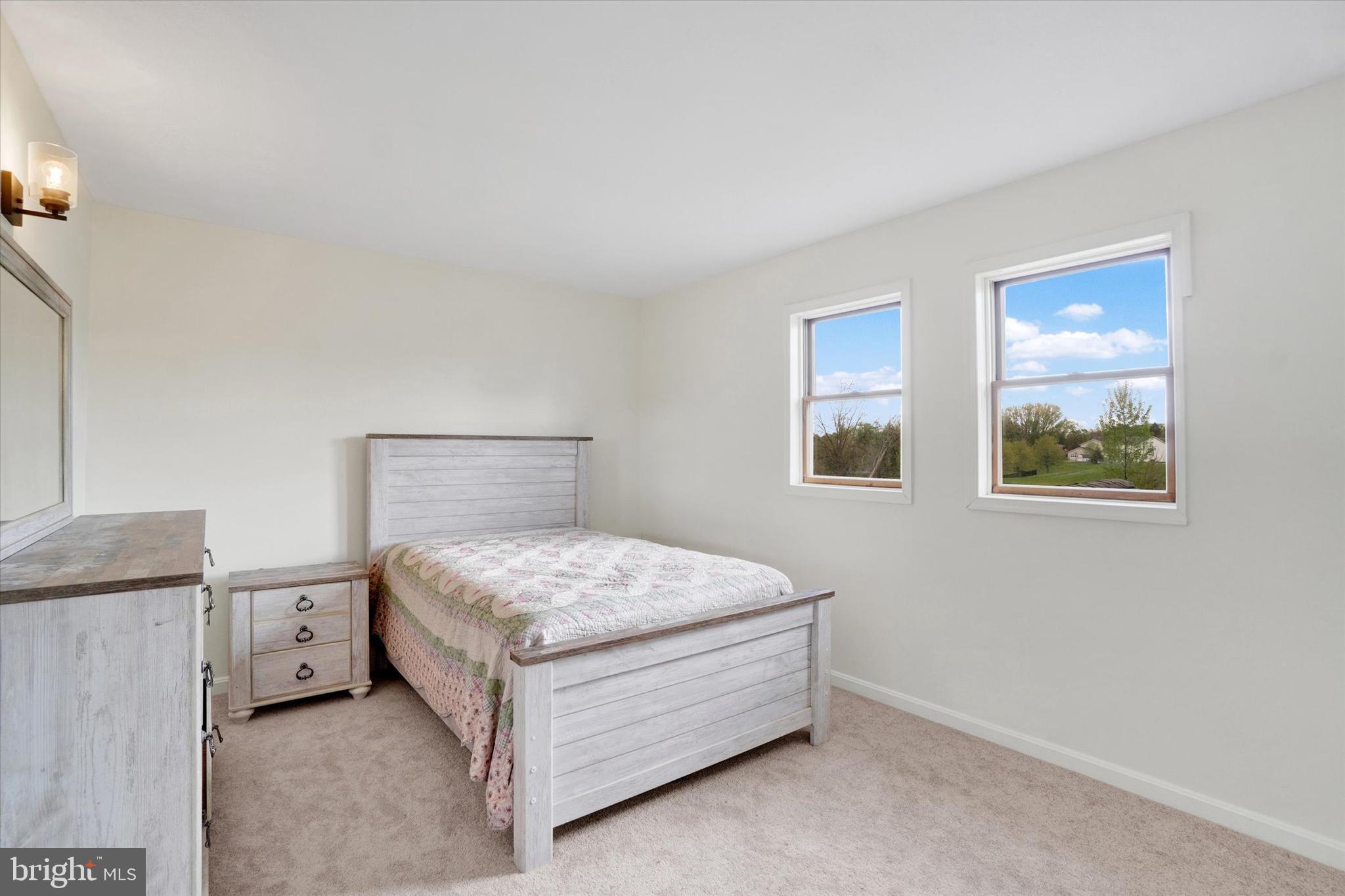 1190 Cherimoya Street York, PA 17404 - Photo 27 of 33 a bed sitting in a bedroom next to a window