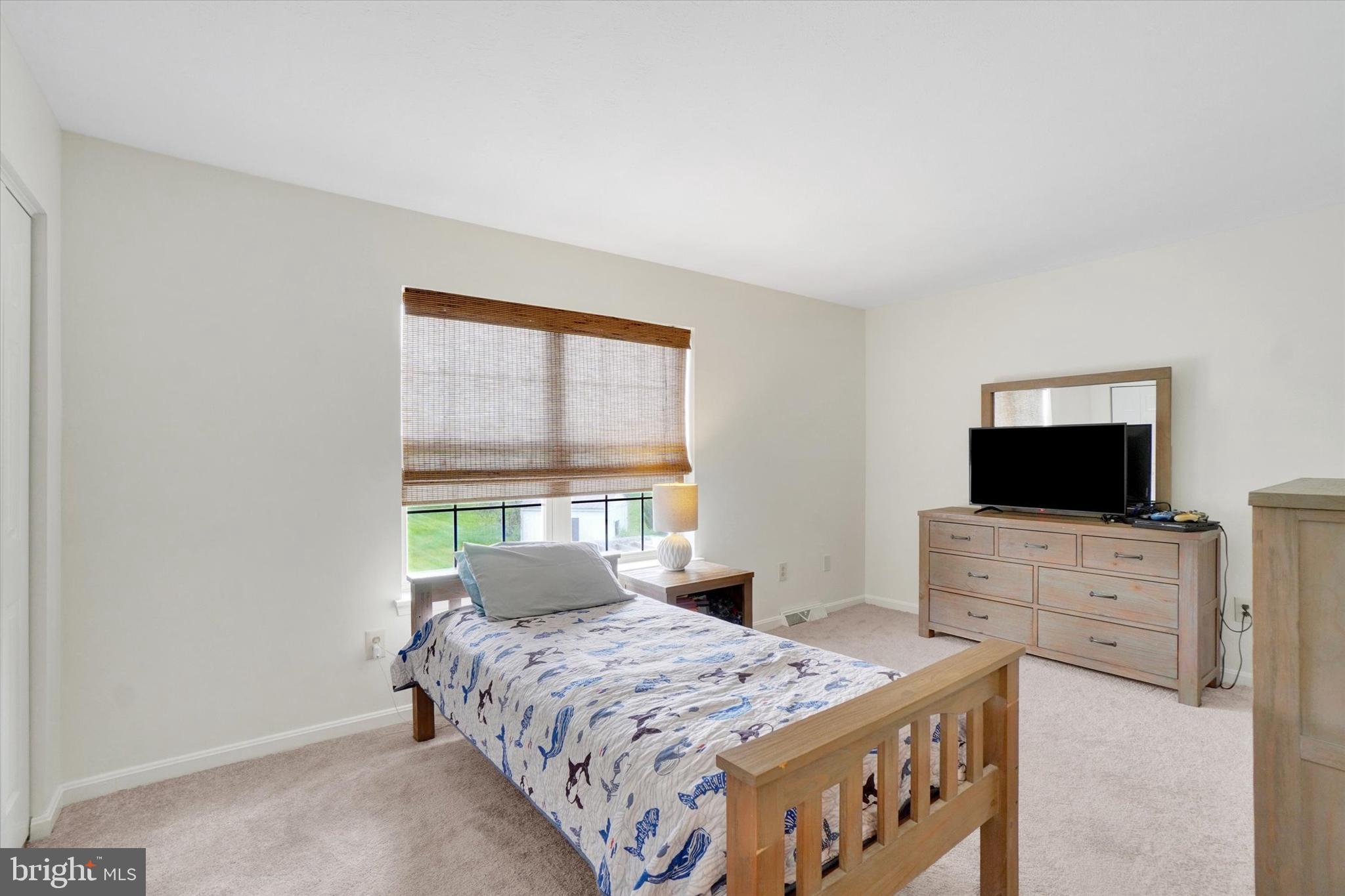 1190 Cherimoya Street York, PA 17404 - Photo 29 of 33 a bedroom with a bed and a flat screen tv