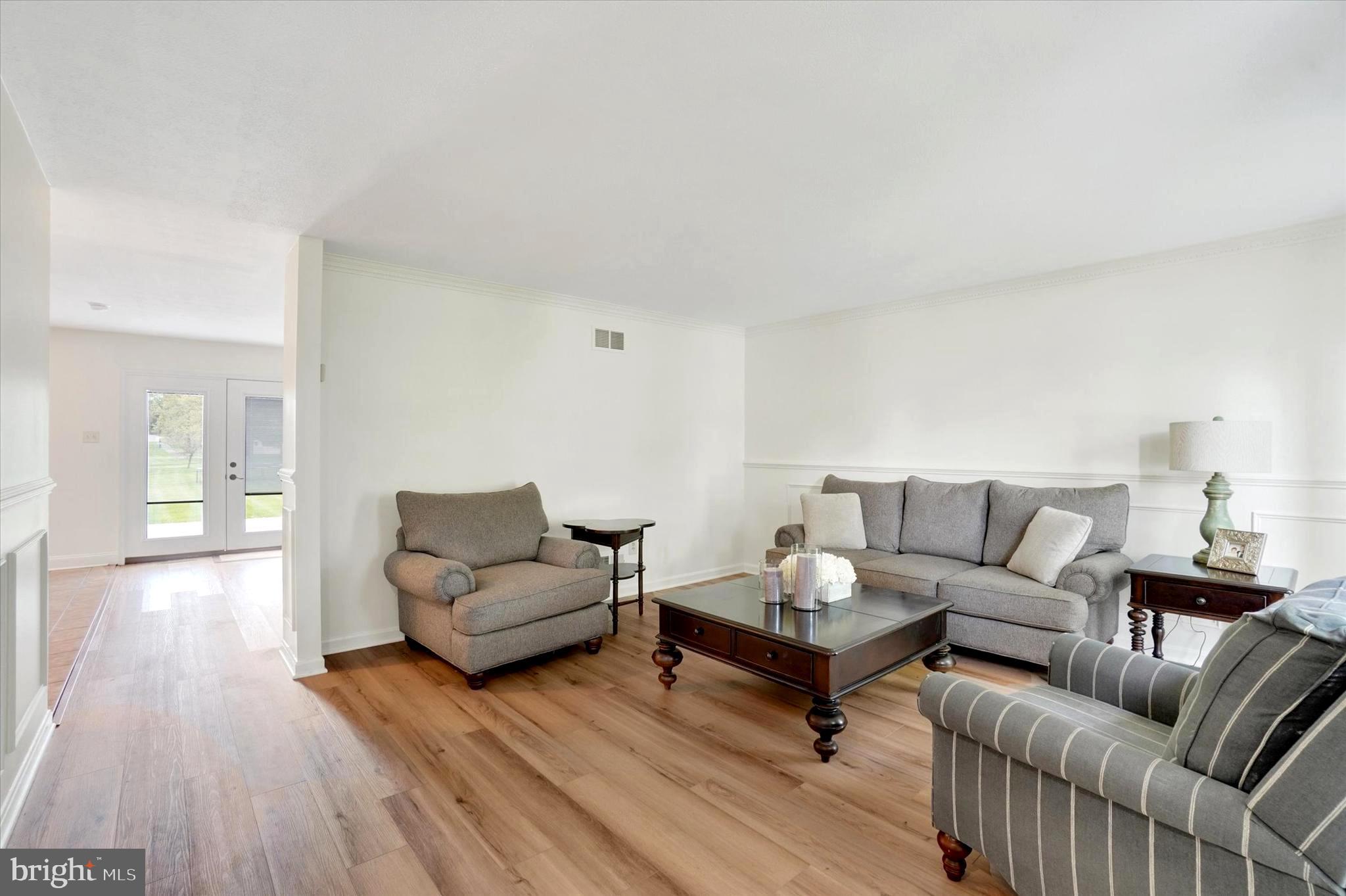 1190 Cherimoya Street York, PA 17404 - Photo 9 of 33 a living room with furniture and a wooden floor