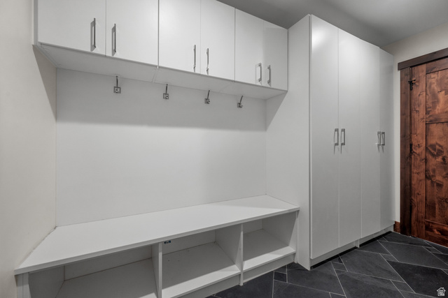 4221 Juniper Circle Alpine, UT 84004 - Photo 42 of 66 Built-in storage system featuring white cabinetry with silver-tone hardware, an integrated bench with open cubbies, and multiple wall hooks