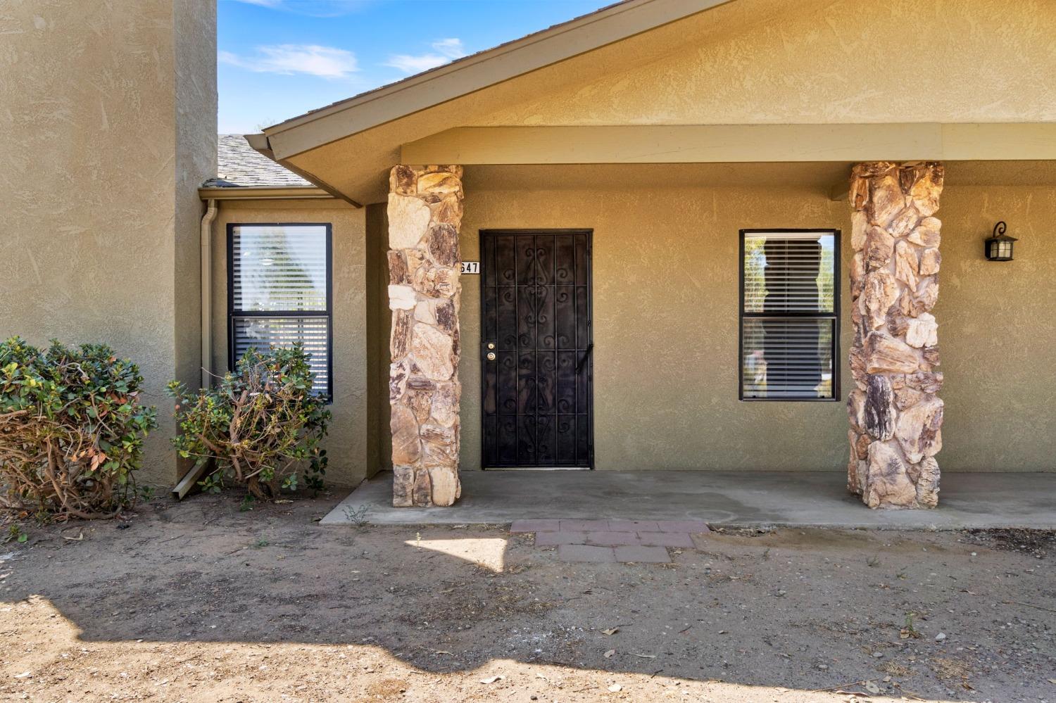 17647 Fairfield Drive Madera, CA 93638 - Photo 4 of 34 a view of a house with potted plants