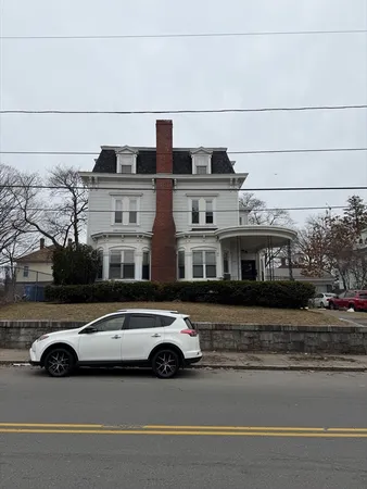 a view of a car parked in front of a building