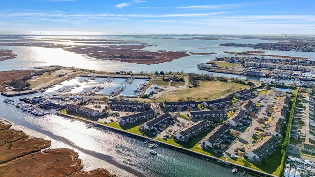 a kitchen with stainless steel appliances granite countertop a stove a refrigerator and a sink