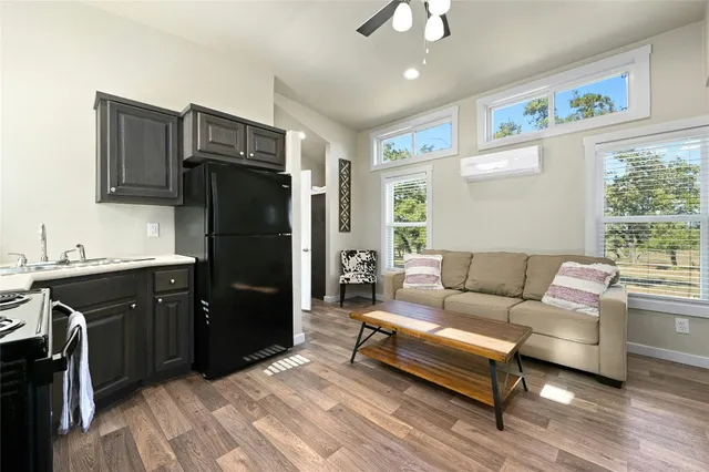 a kitchen with stainless steel appliances a stove a sink and a microwave