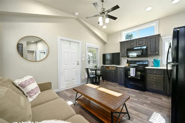 a living room with furniture and a window