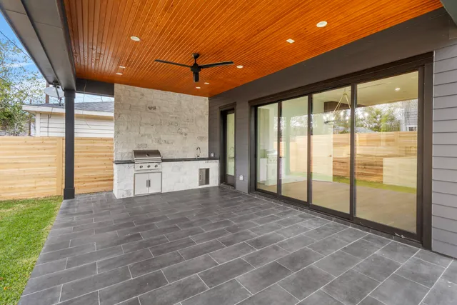 a view of a kitchen with a sink and cabinets