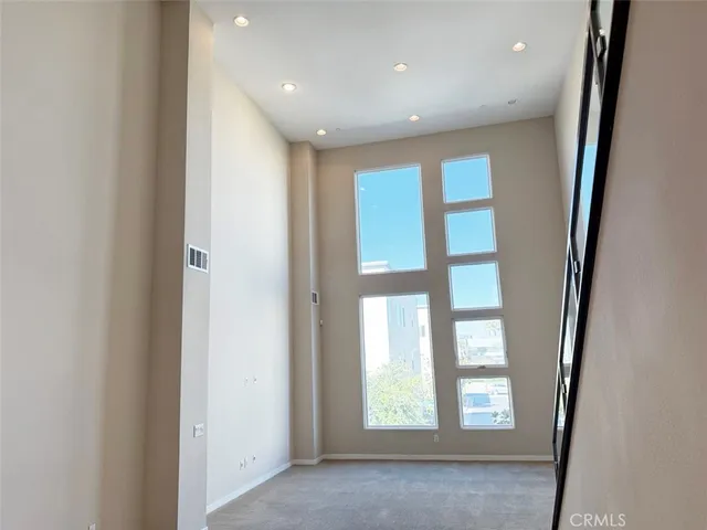 a view of empty room with windows