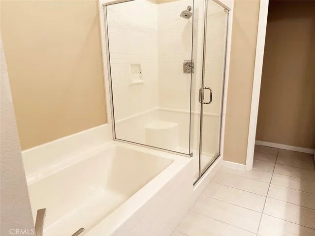 a bathroom with a bathtub and shower
