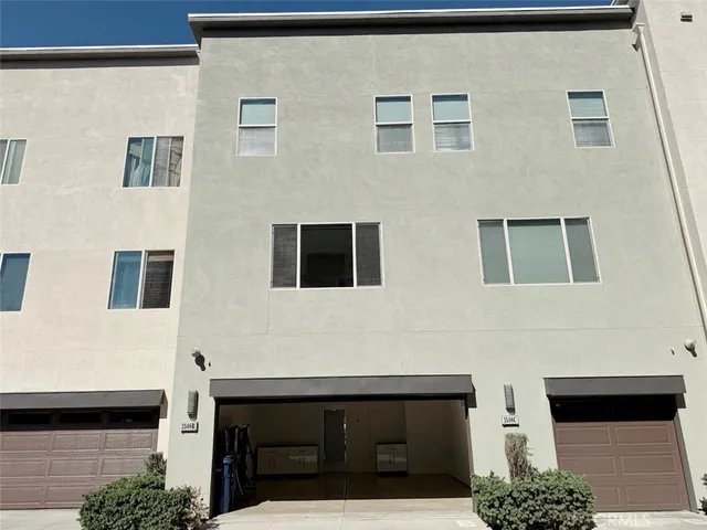 a view of entryway with wooden floor and stairs