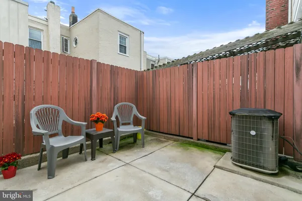 a view of a house with a backyard and a window