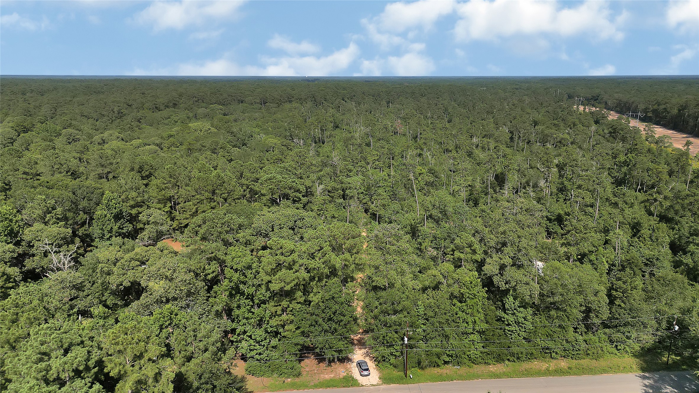 2161 Fostoria Tram Road Cleveland, TX 77328 - Photo 2 of 4 a view of a field with an outdoor space
