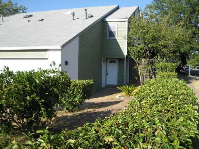 a backyard of a house with lots of green space