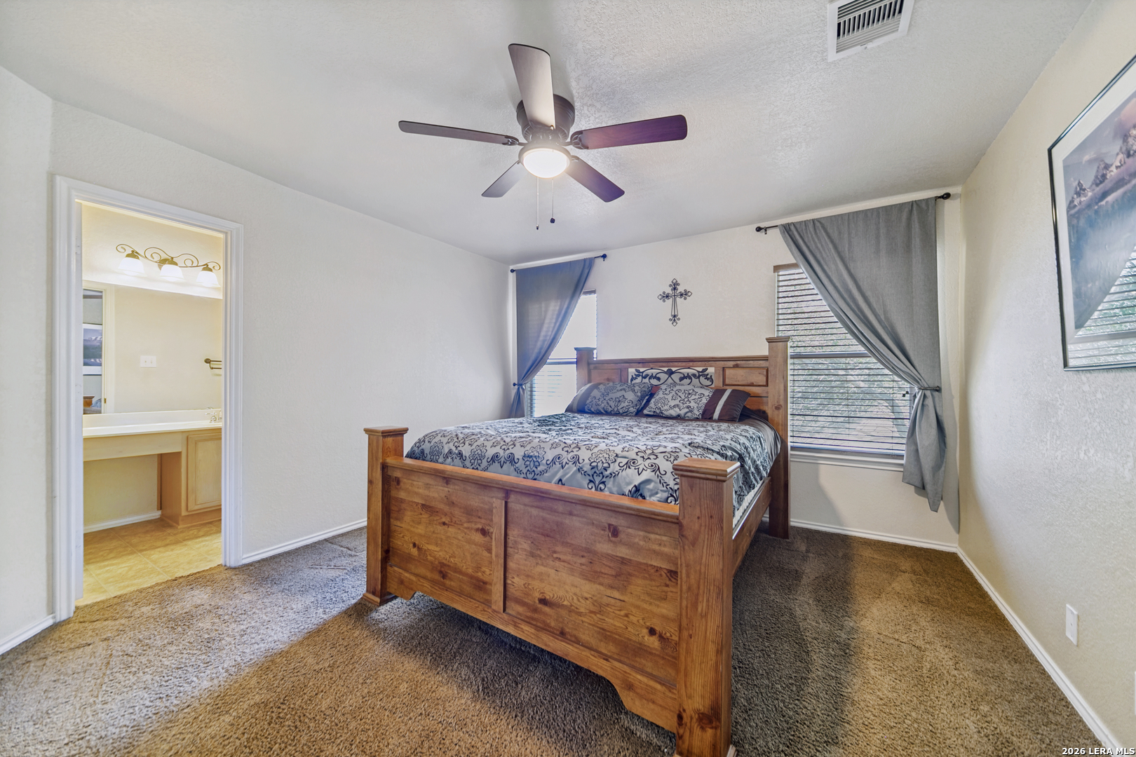 127 Hampton Bend Boerne, TX 78006 - Photo 15 of 25 a bedroom with a bed and a ceiling fan