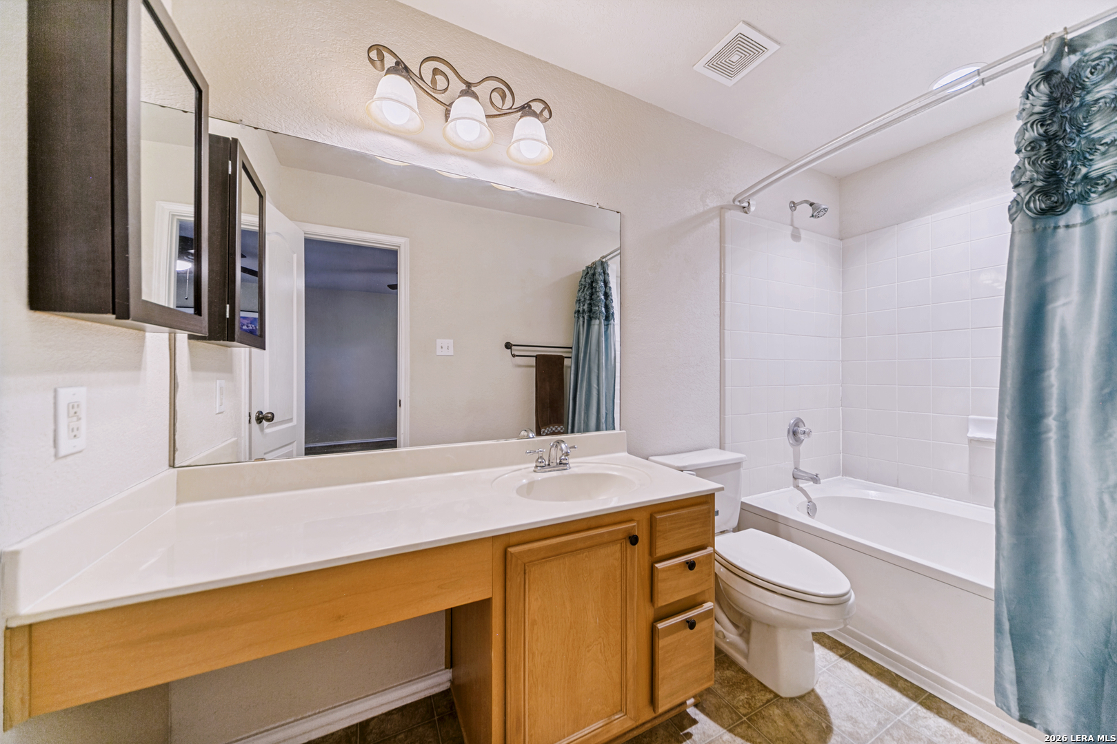 127 Hampton Bend Boerne, TX 78006 - Photo 17 of 25 a bathroom with a granite countertop sink toilet and shower