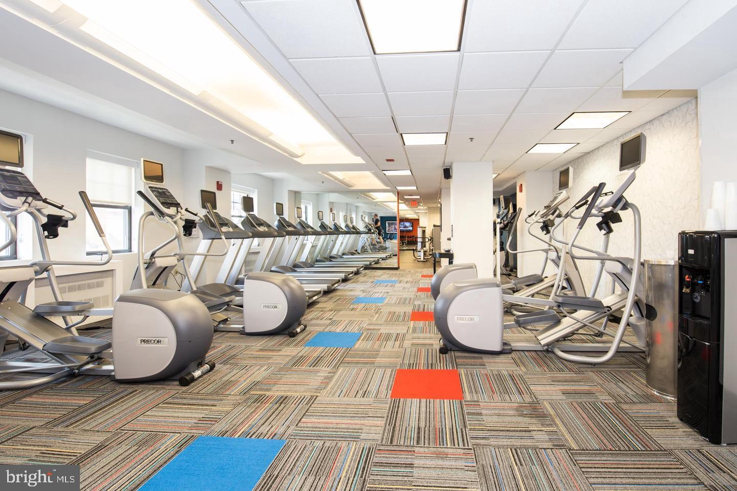 1701 Locust Street, Unit 1607 Philadelphia, PA 19103 - Photo 17 of 26 a room with gym equipment and wooden floor