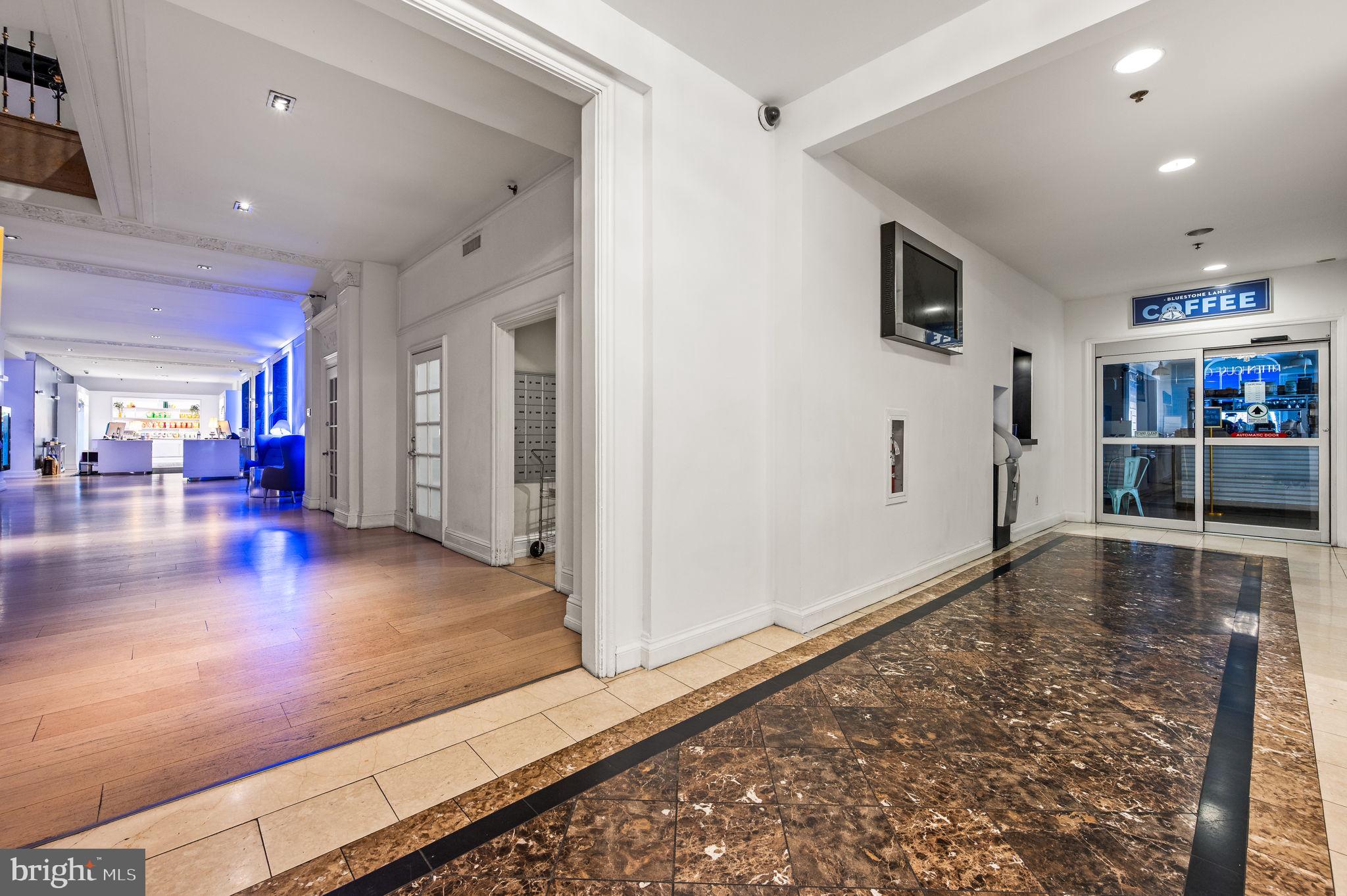1701 Locust Street, Unit 1607 Philadelphia, PA 19103 - Photo 19 of 26 a view of a livingroom with furniture wooden floor and a window