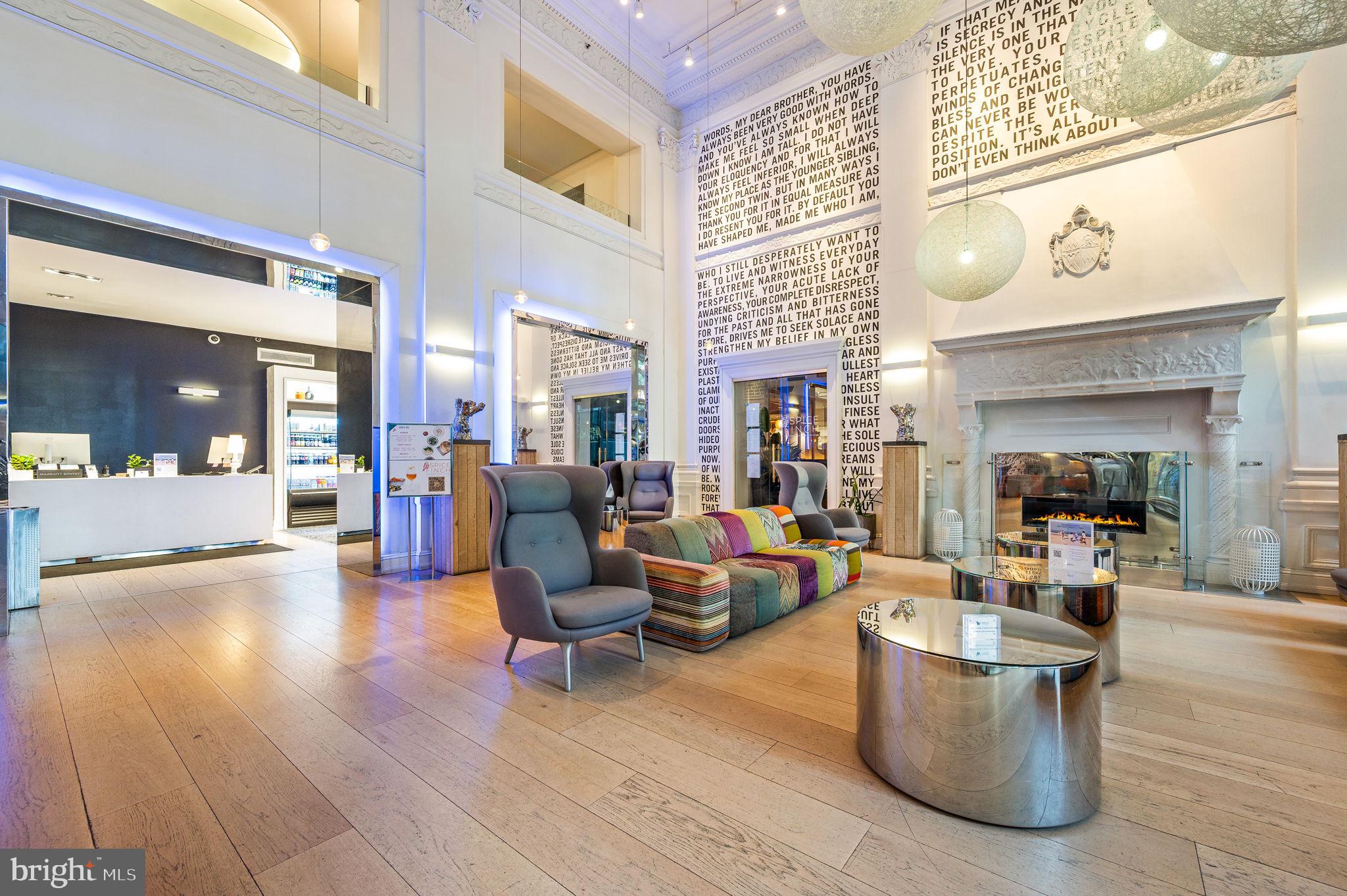 1701 Locust Street, Unit 1607 Philadelphia, PA 19103 - Photo 22 of 26 a living room with furniture and fireplace