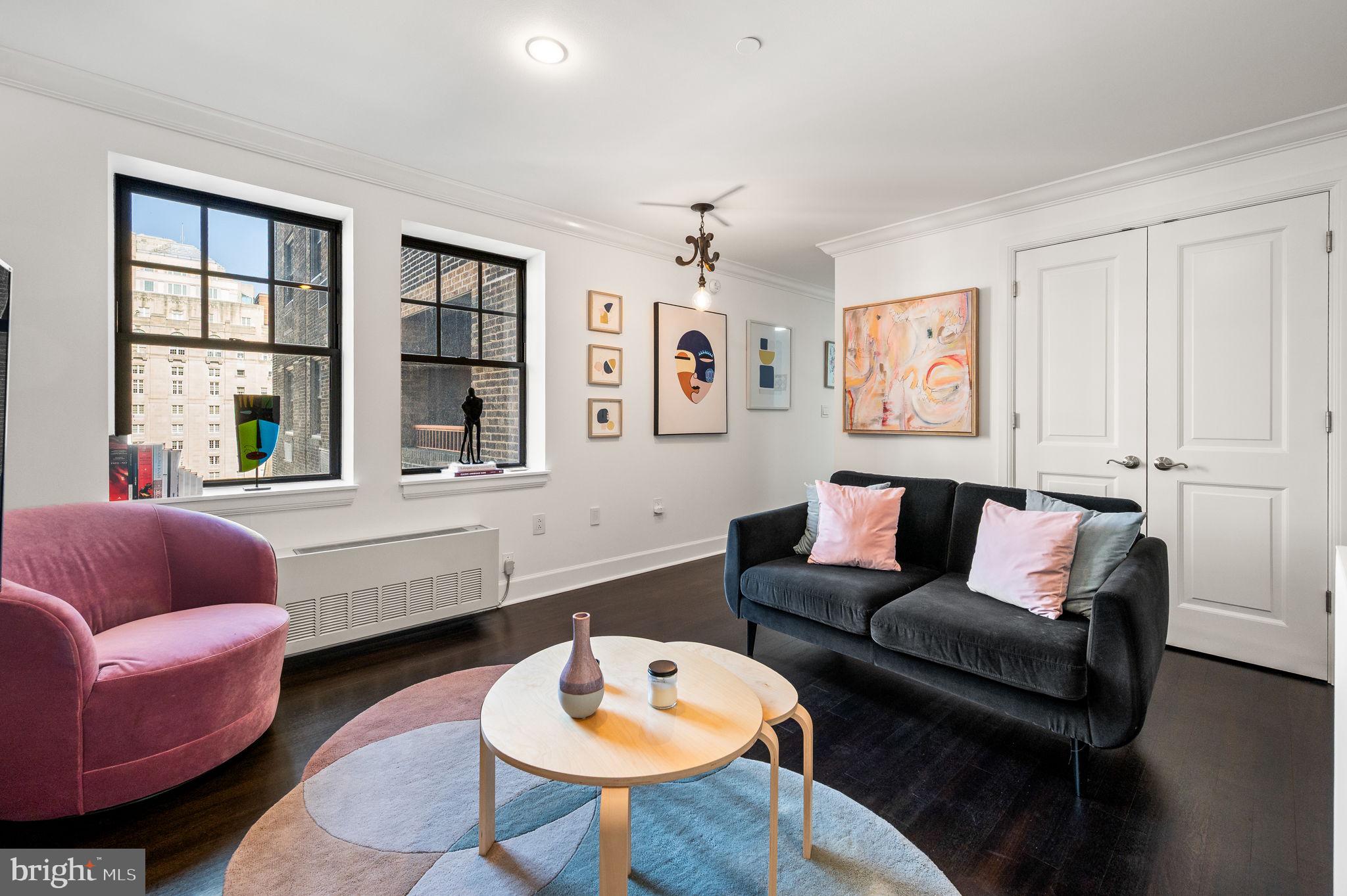 1701 Locust Street, Unit 1607 Philadelphia, PA 19103 - Photo 3 of 26 a living room with furniture and a large window