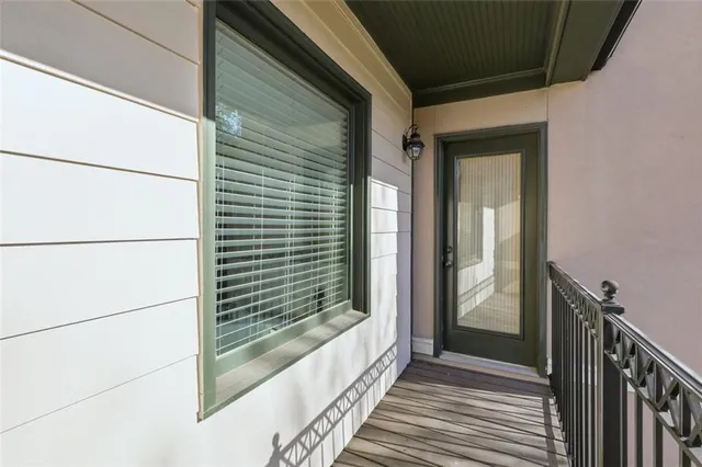 a bathroom with a granite countertop tub sink and mirror