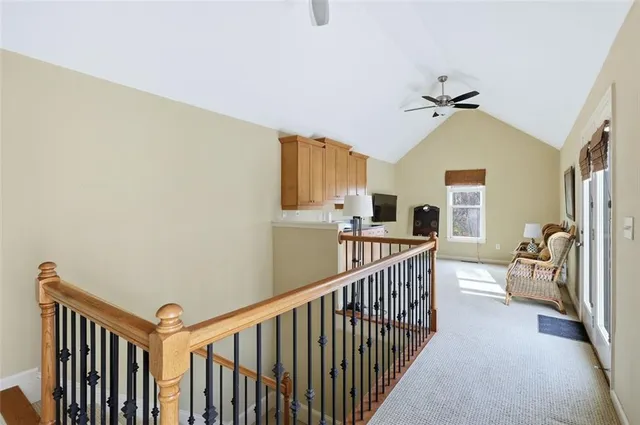a balcony with furniture and a potted plant