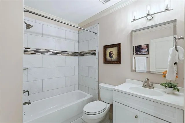 a picture of a living room with furniture and a fireplace