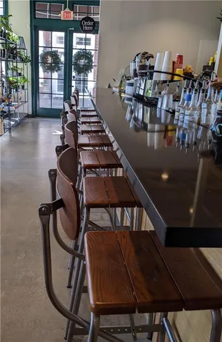 a view of backyard with swimming pool and furniture