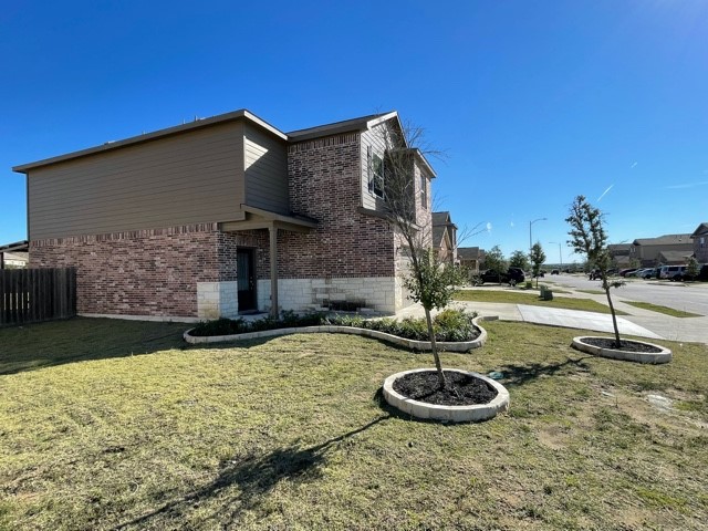 19808 Grover Cleveland Way Manor, TX 78653 - Photo 1 of 1 a view of a house with backyard