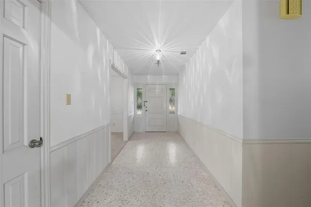 an empty room with furniture and window