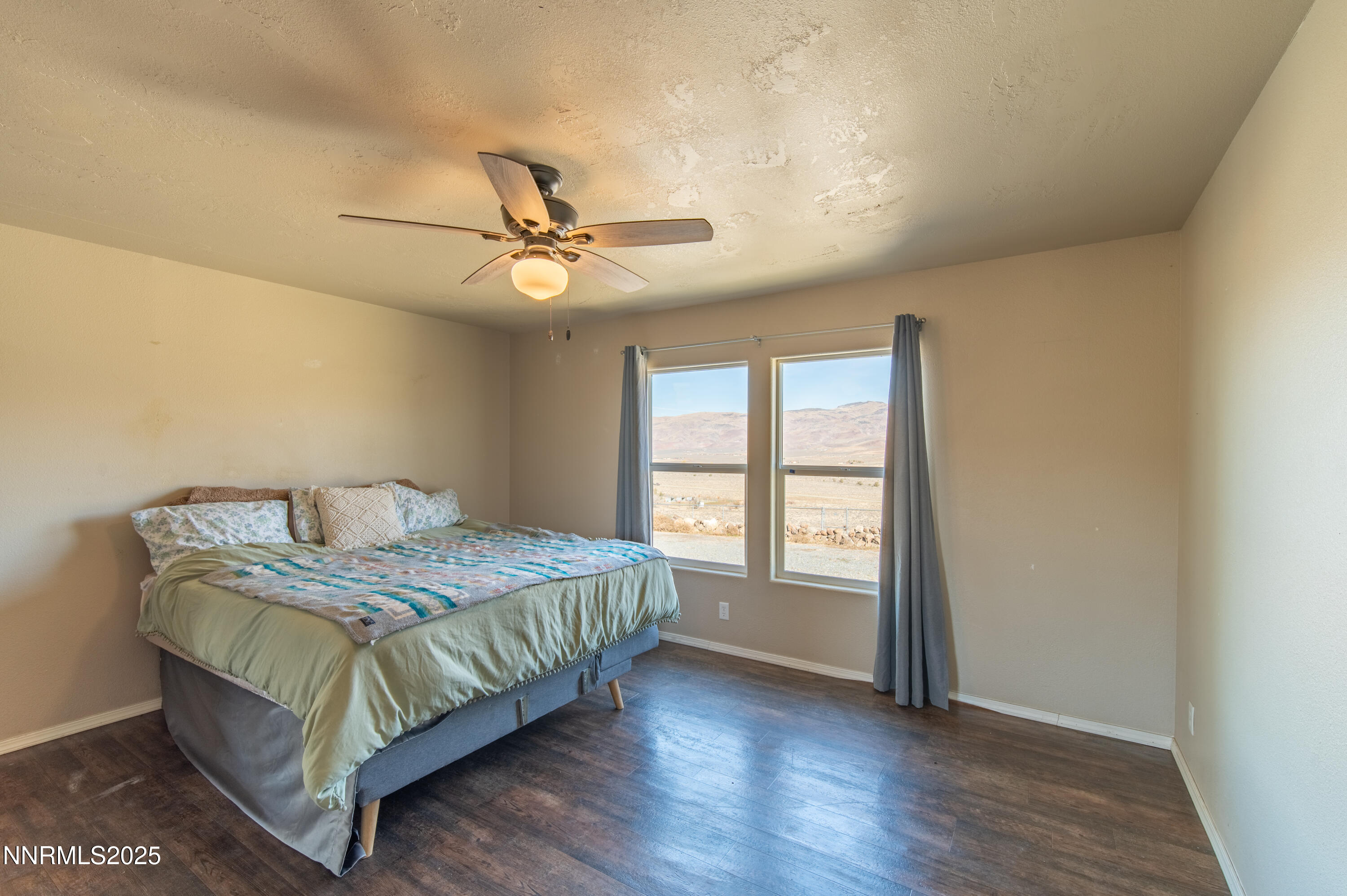 3900 Morning Dove Road Reno, NV 89510 - Photo 13 of 27 a bed sitting in a spacious bedroom next to a window