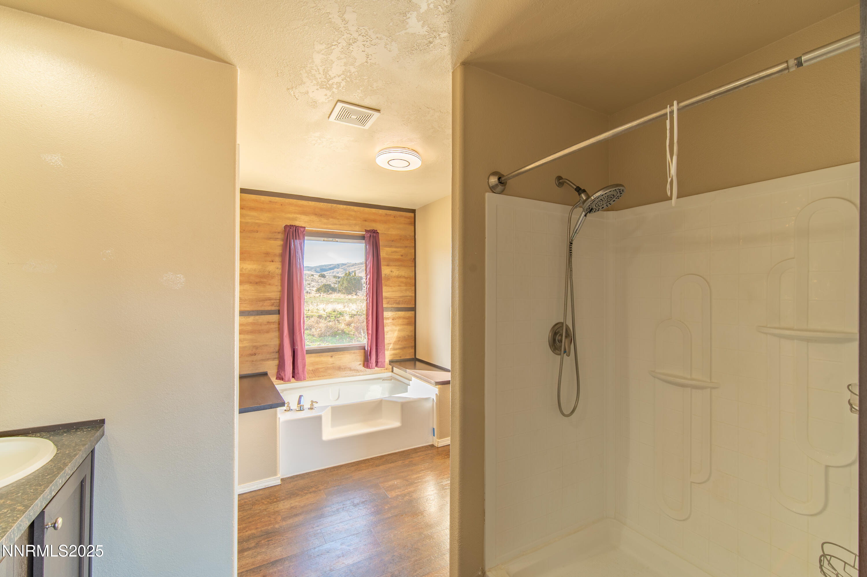 3900 Morning Dove Road Reno, NV 89510 - Photo 15 of 27 a view of a bathroom with a glass door shower