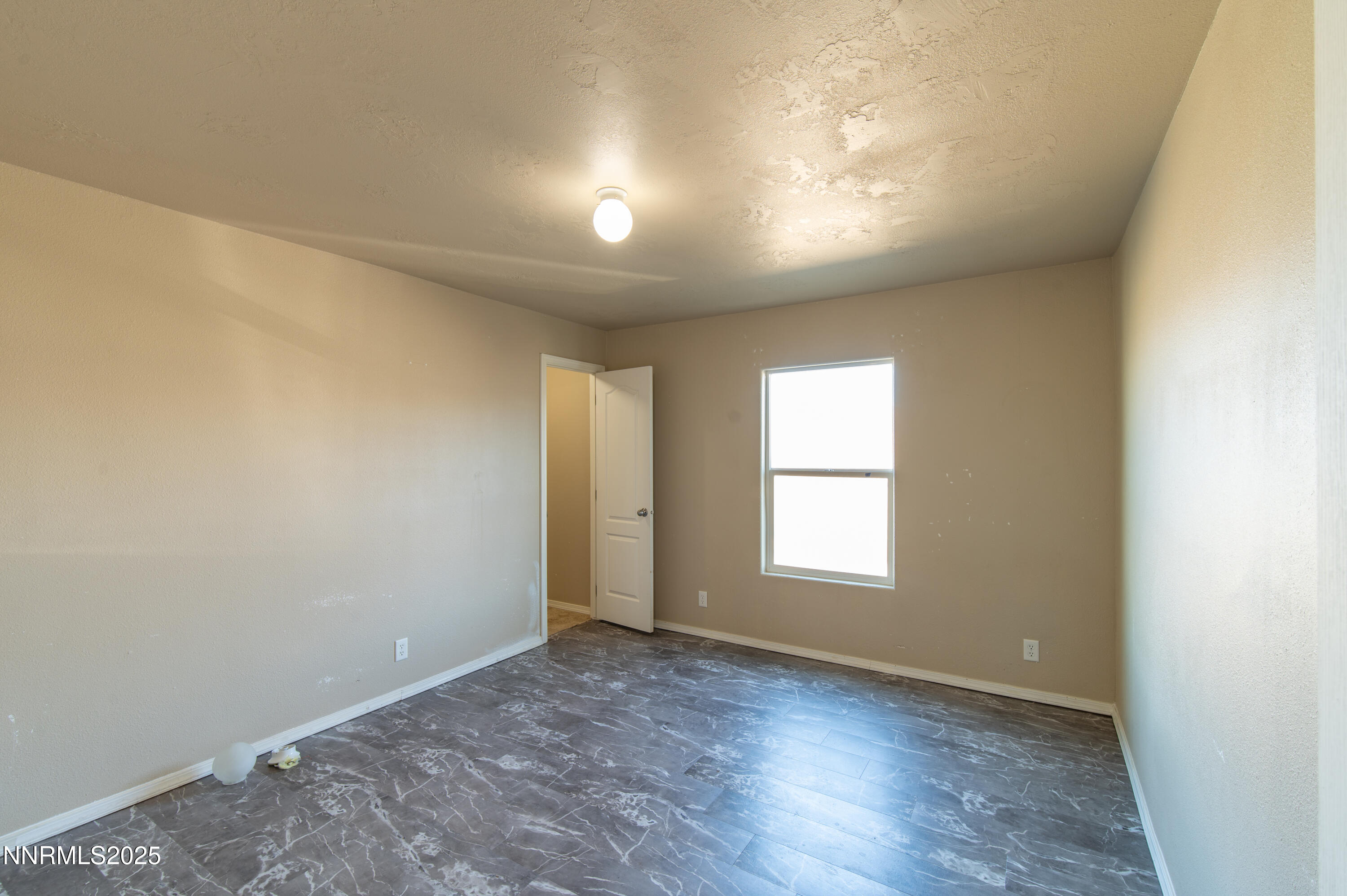 3900 Morning Dove Road Reno, NV 89510 - Photo 16 of 27 an empty room with wooden floor and windows