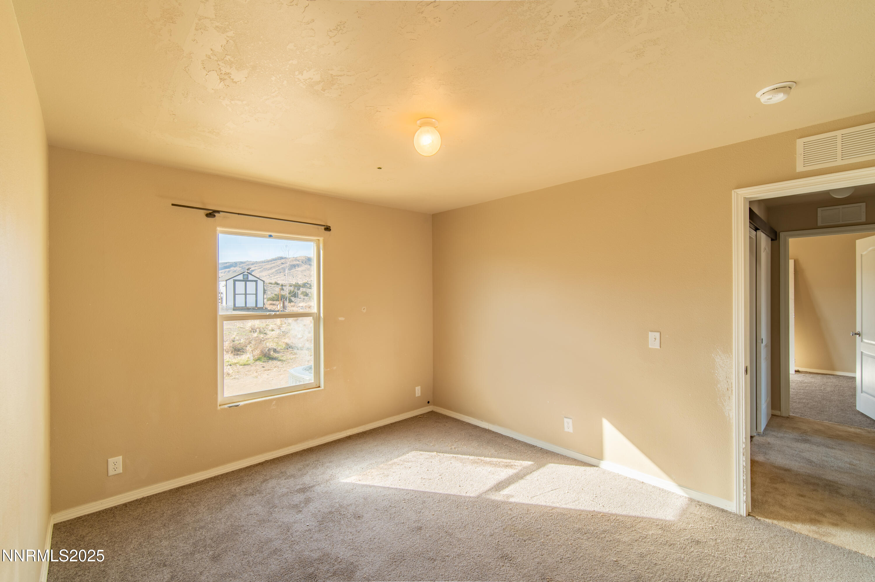 3900 Morning Dove Road Reno, NV 89510 - Photo 20 of 27 an empty room with windows