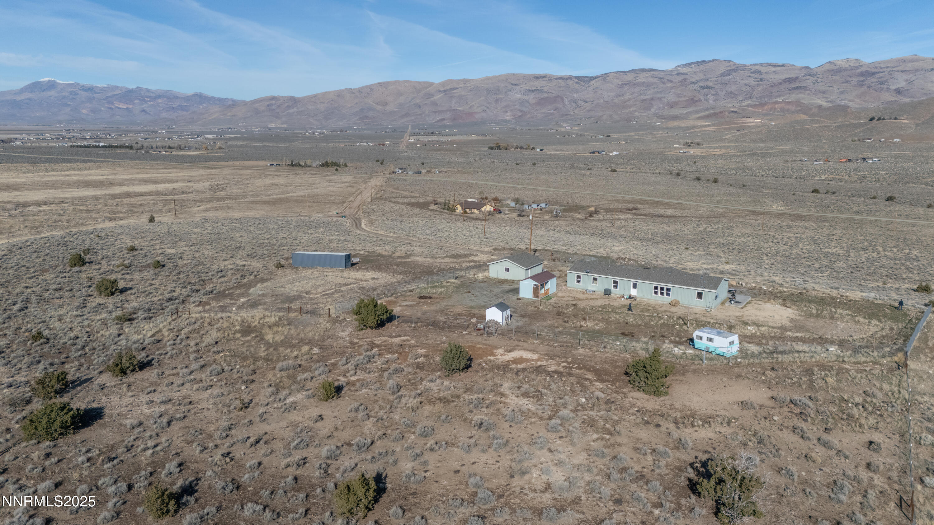 3900 Morning Dove Road Reno, NV 89510 - Photo 2 of 27 a view of a dry field with mountains in the background