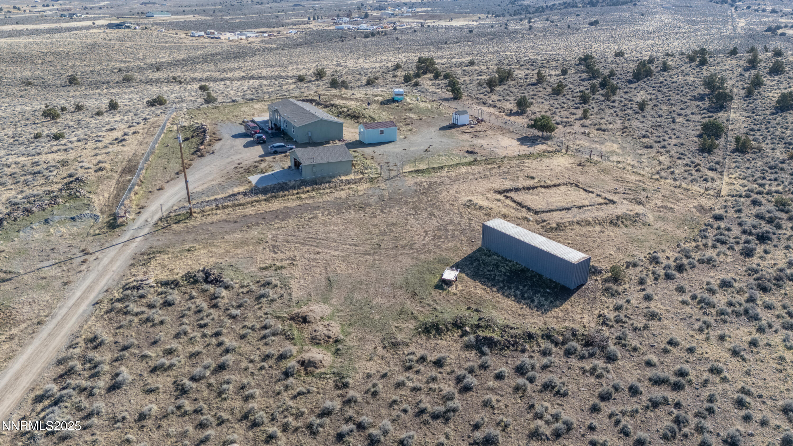 3900 Morning Dove Road Reno, NV 89510 - Photo 3 of 27 a view of a dry yard with wooden fence