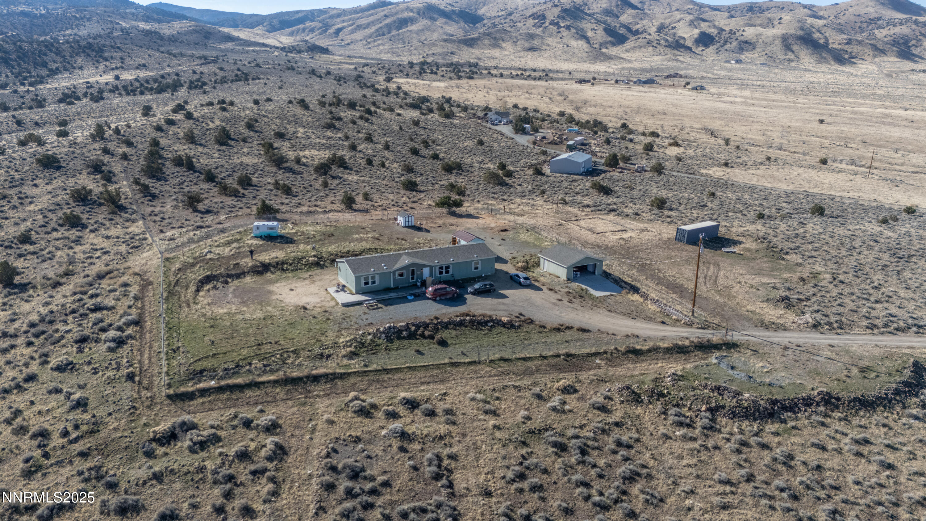 3900 Morning Dove Road Reno, NV 89510 - Photo 4 of 27 a view of a dry field with trees