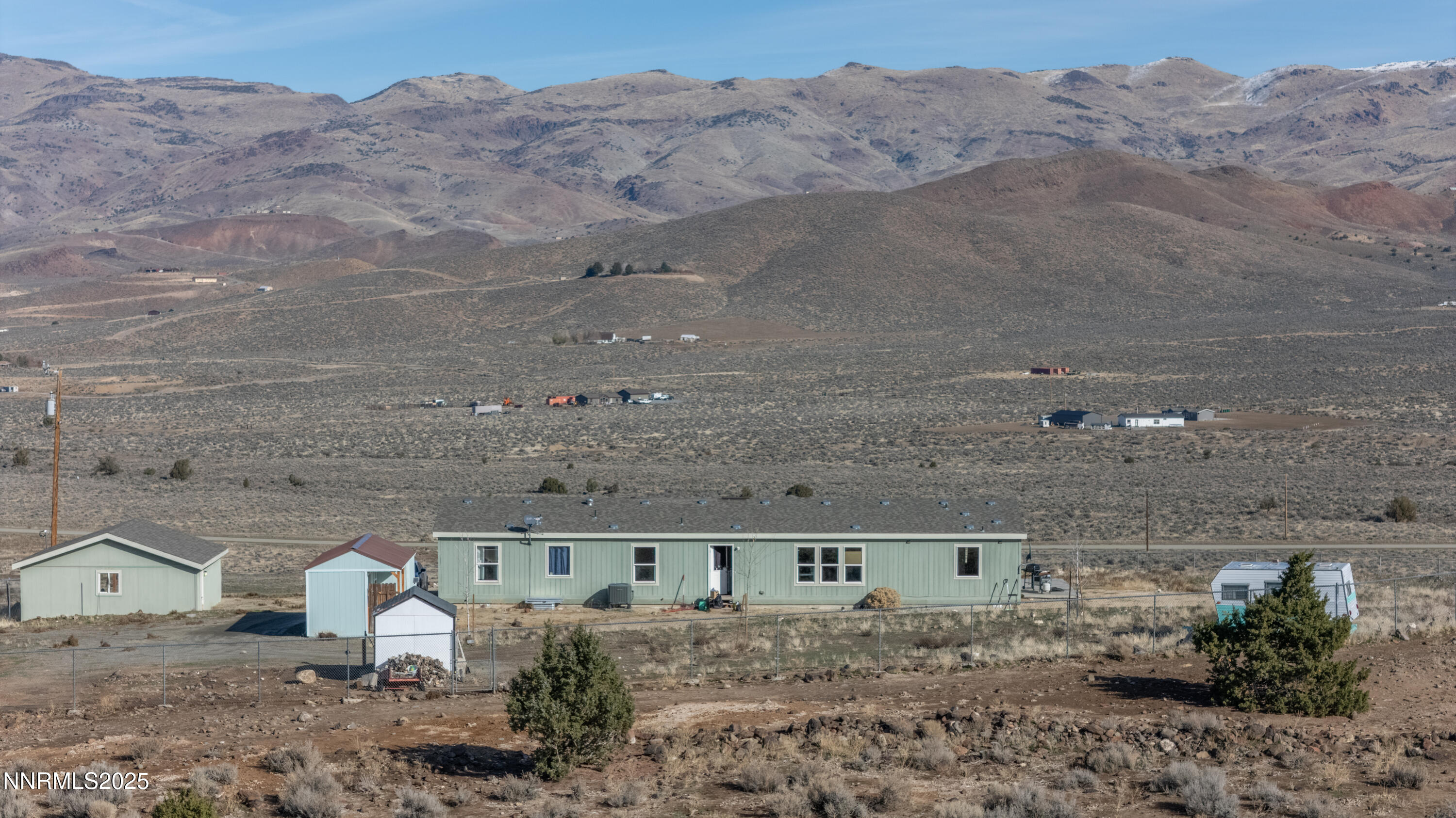 3900 Morning Dove Road Reno, NV 89510 - Photo 5 of 27 a view of a backyard with mountain view and wooden floor