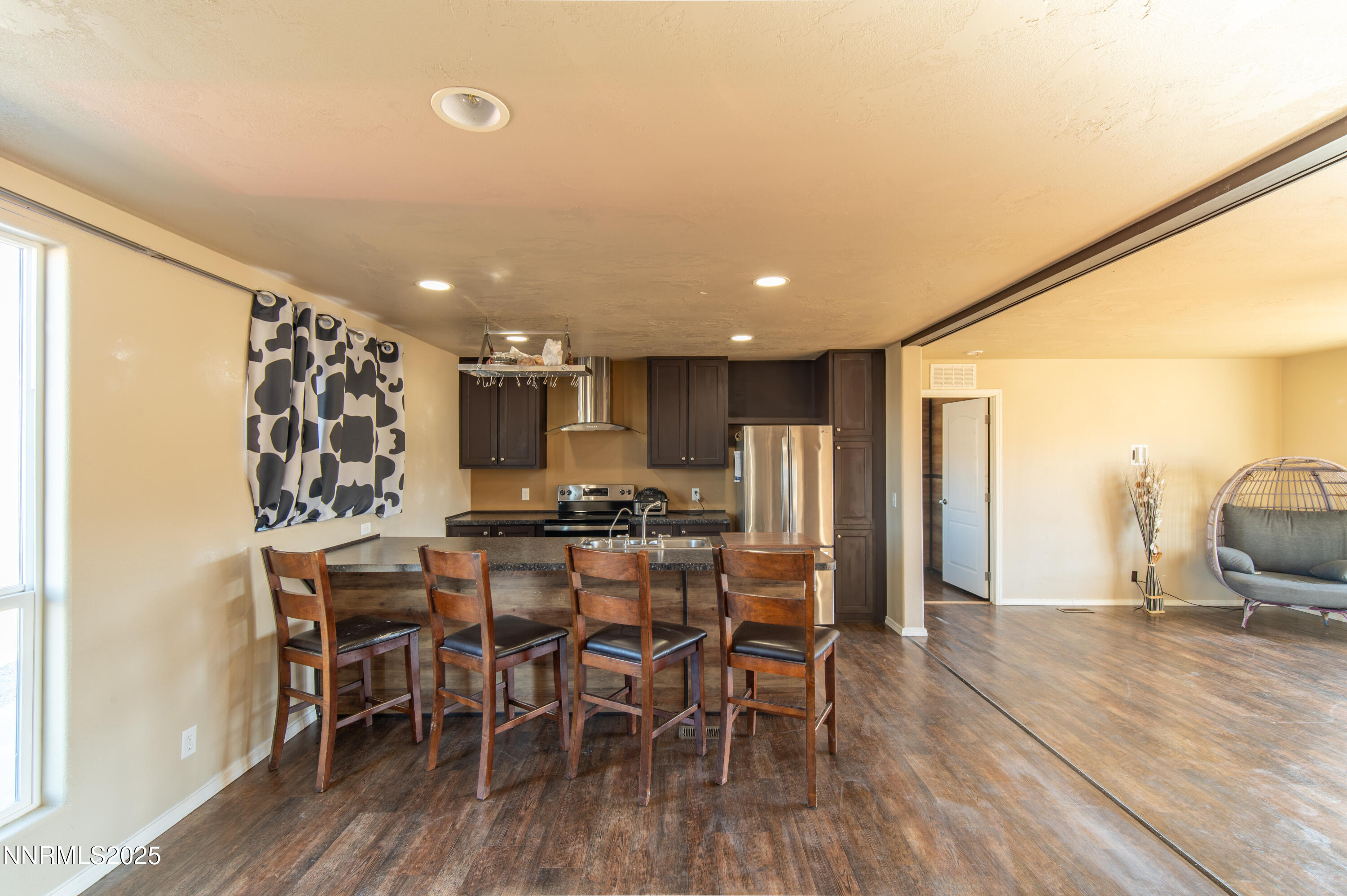 3900 Morning Dove Road Reno, NV 89510 - Photo 7 of 27 a view of a dining room with furniture window and wooden floor
