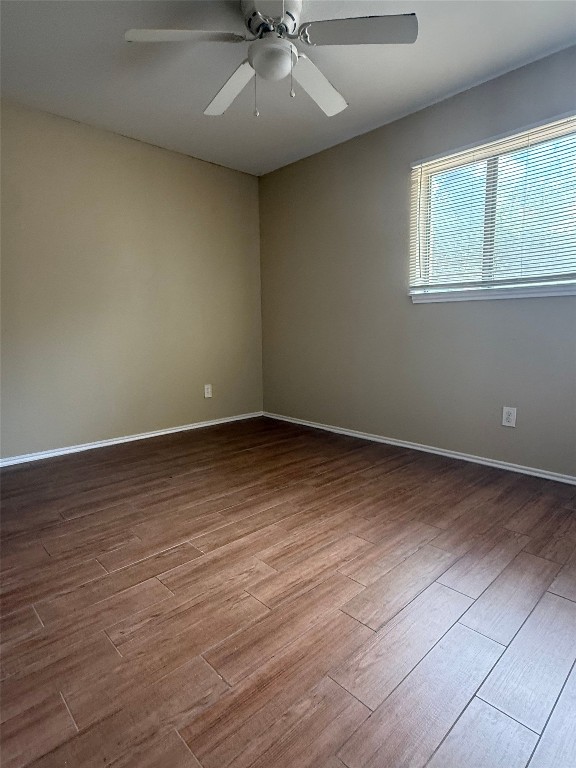1808 Rio Grande Street, Unit 3 Austin, TX 78701 - Photo 17 of 29 an empty room with wooden floor and windows