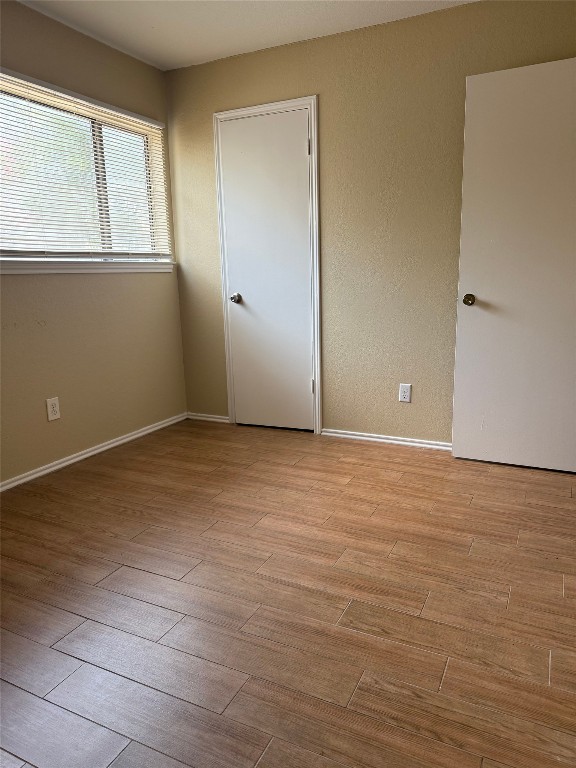 1808 Rio Grande Street, Unit 3 Austin, TX 78701 - Photo 18 of 29 wooden floor in an empty room
