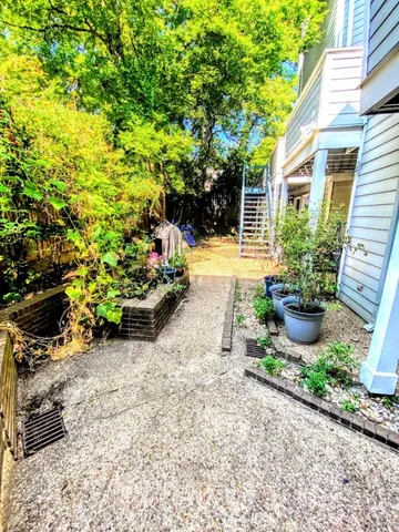a view of a livingroom with furniture and a fire pit