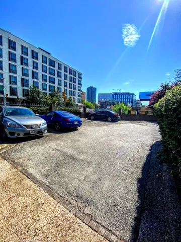 a view of a house with sitting area and potted plants