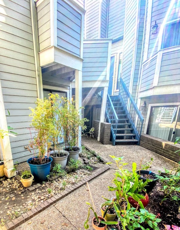 1808 Rio Grande Street, Unit 3 Austin, TX 78701 - Photo 26 of 29 a view of a house with sitting area and potted plants